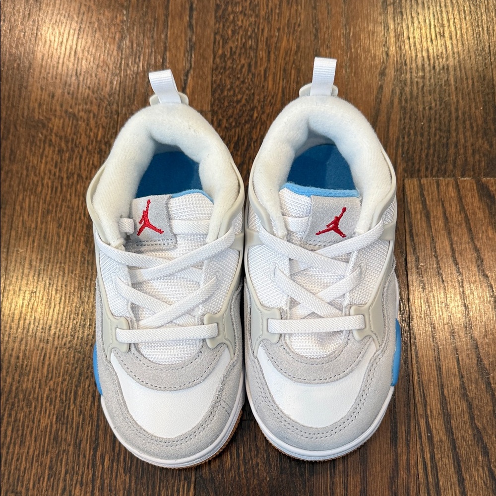 Toddler Boy skip on Nike Jordan sneakers
